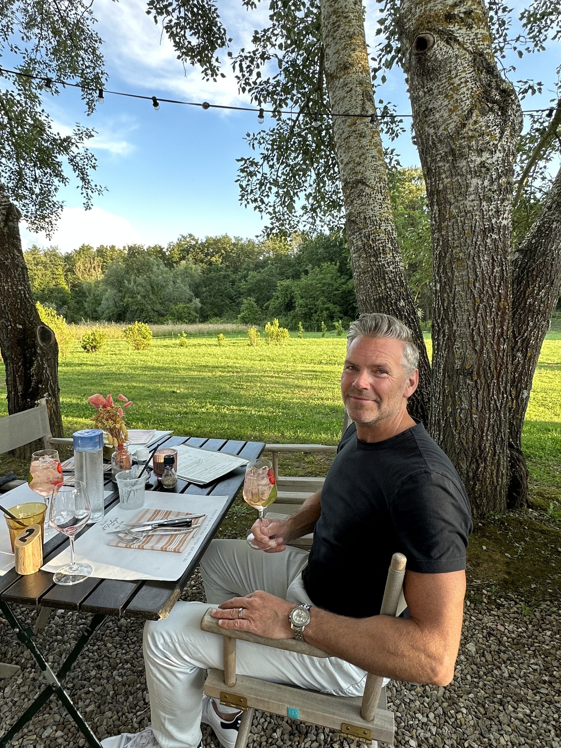 Conrad DeJong outdoors under trees